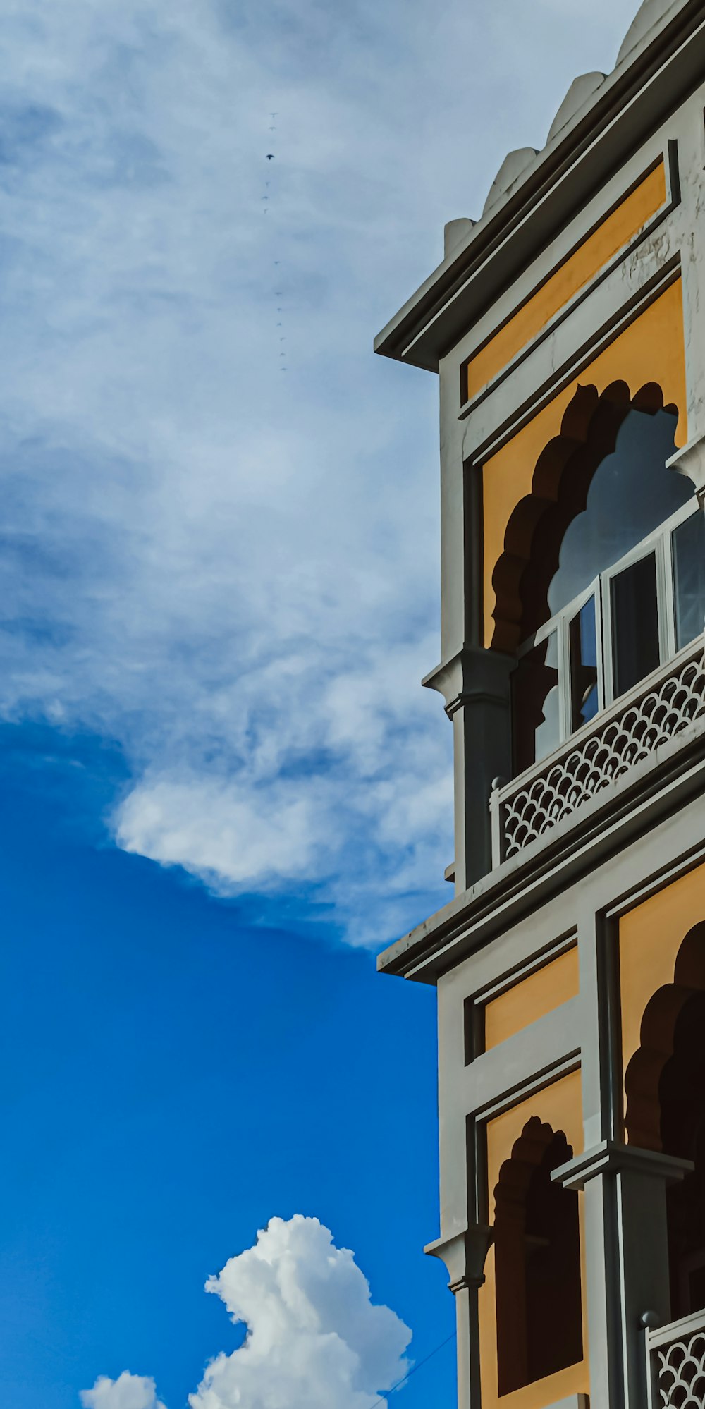 a tall building with a clock on the side of it