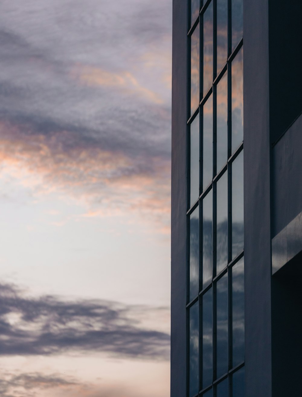 a tall building with a sky in the background