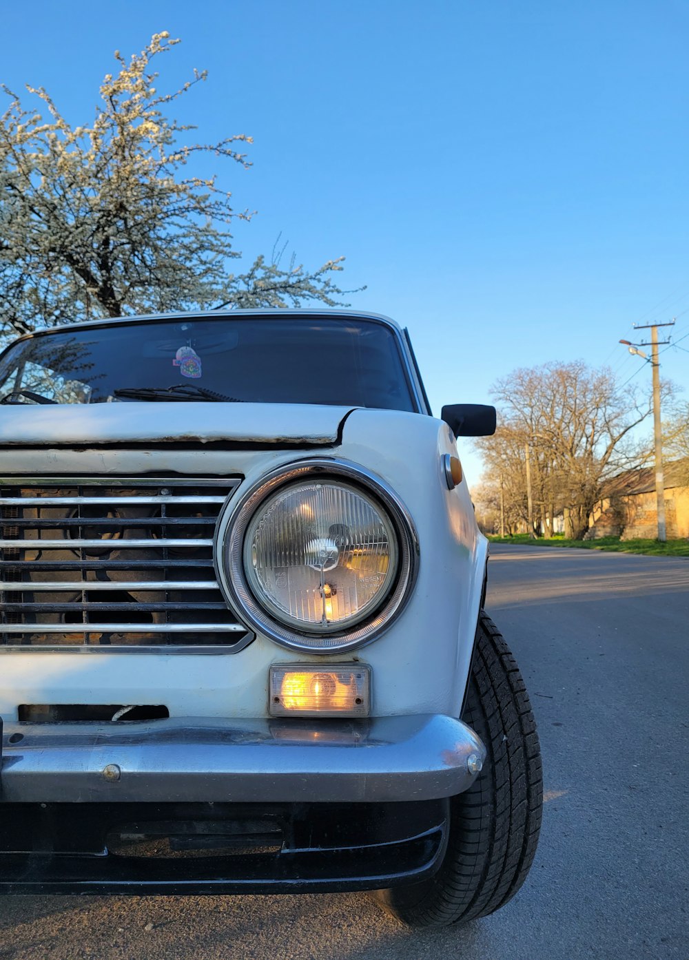 a white car parked on the side of the road