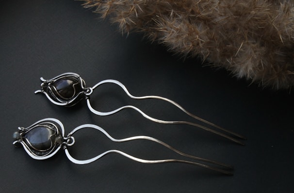 Elegant hair clips and bands on a neutral background.