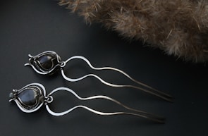 Various pearl hair pins arranged creatively.
