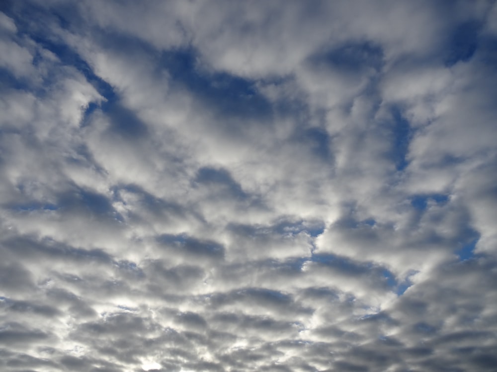 the sky is full of clouds as the sun sets