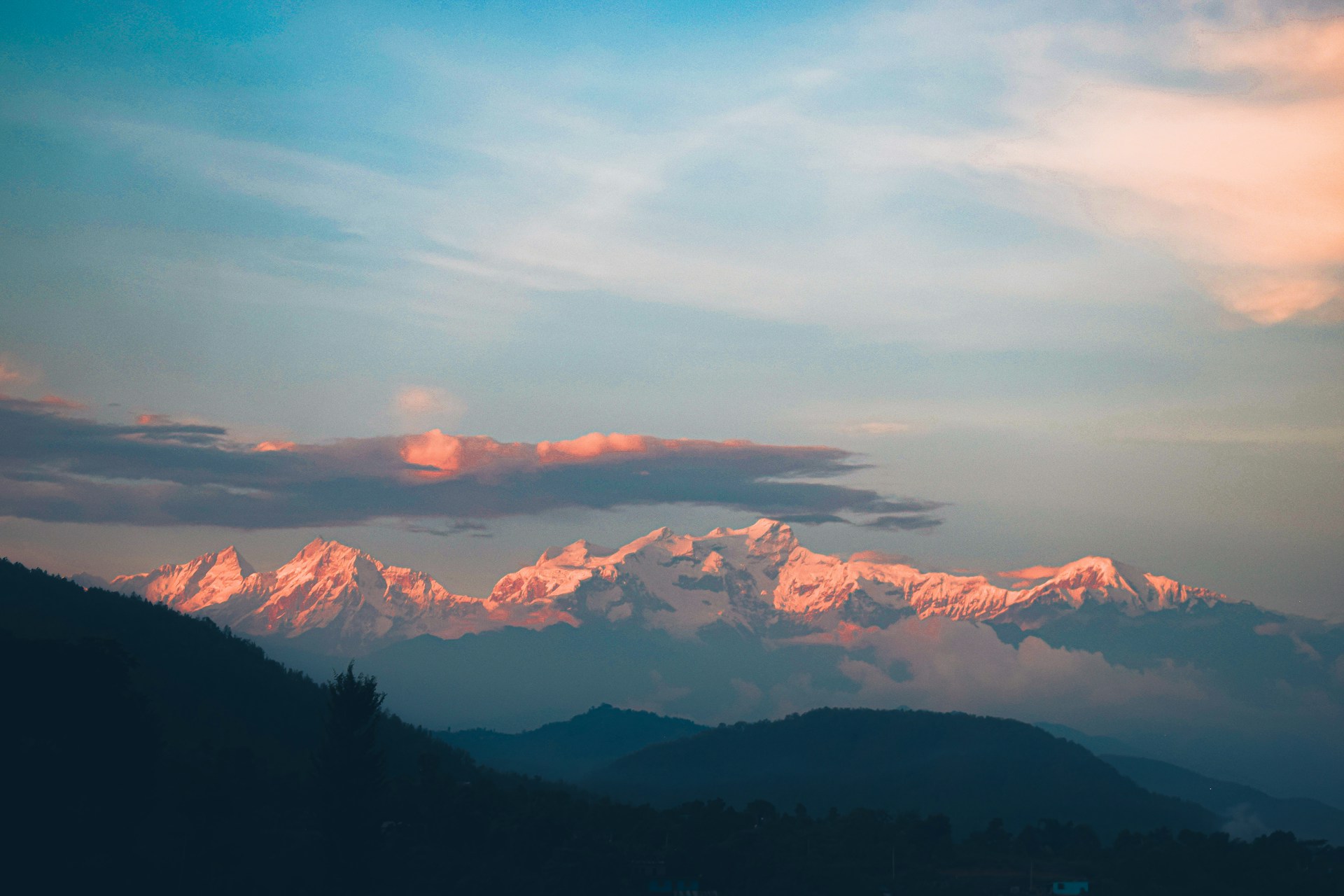a view of a mountain range at sunset