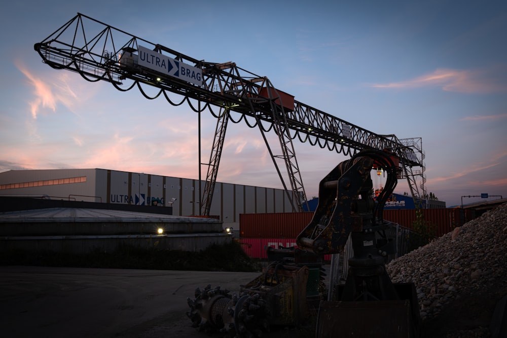 a large crane sitting on top of a pile of dirt