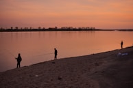 Traditional fishermen on the Casamance River at sunset in Sedhiou.