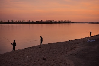 Traditional fishermen on the Casamance River at sunset in Sedhiou.