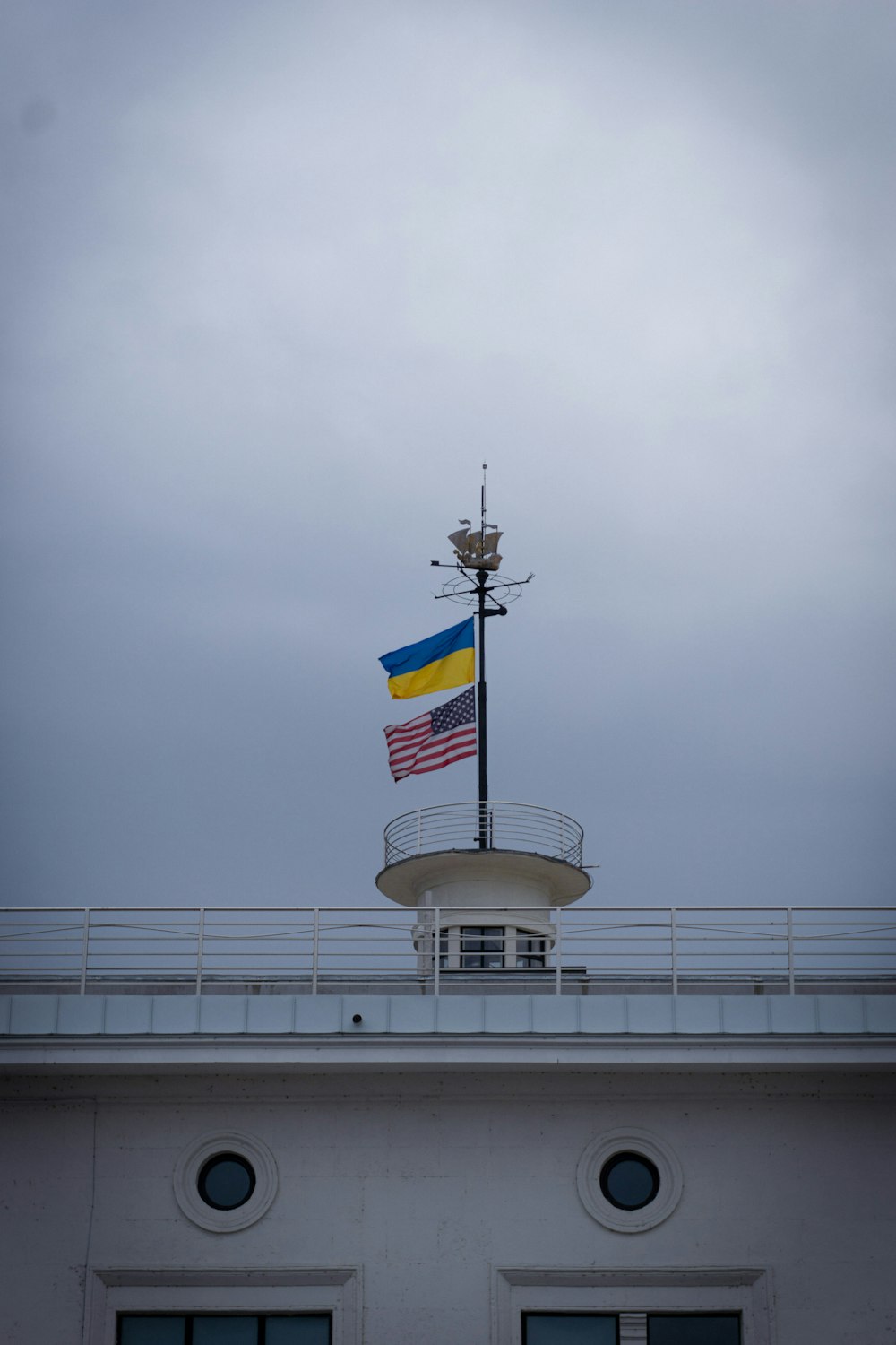 a flag is flying on top of a building