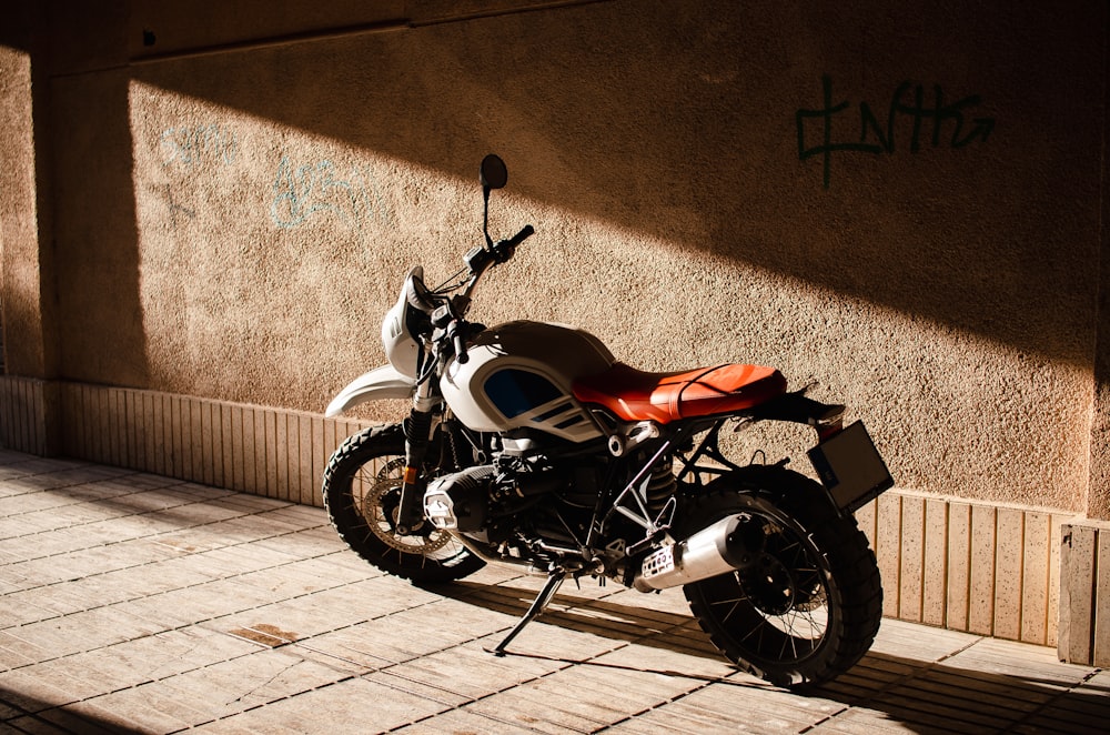 a motorcycle parked on the side of a building