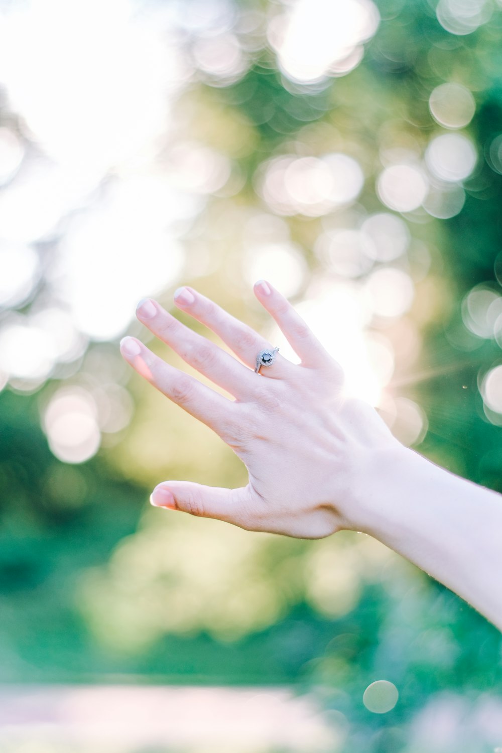 a woman's hand with a ring on it