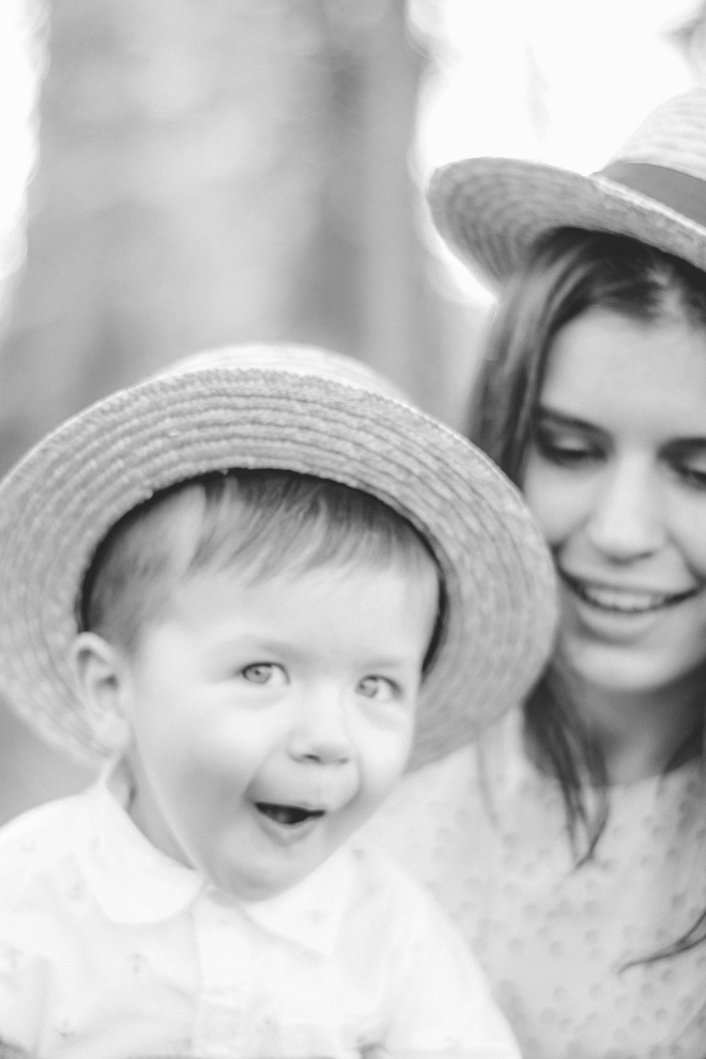 a woman and a young boy wearing hats