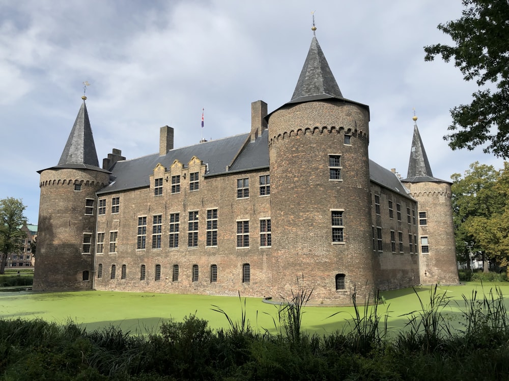 a large brick castle with two towers on top of it