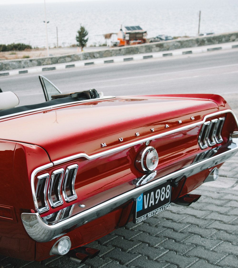 a red car parked on the side of the road