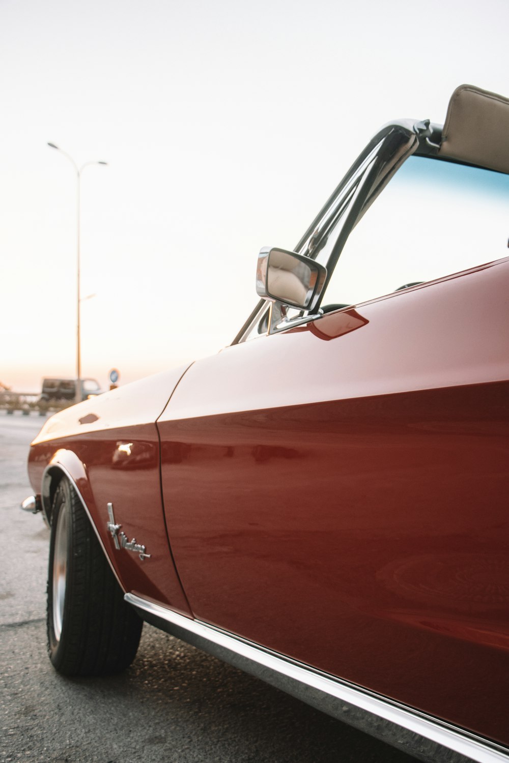 a red car parked in a parking lot