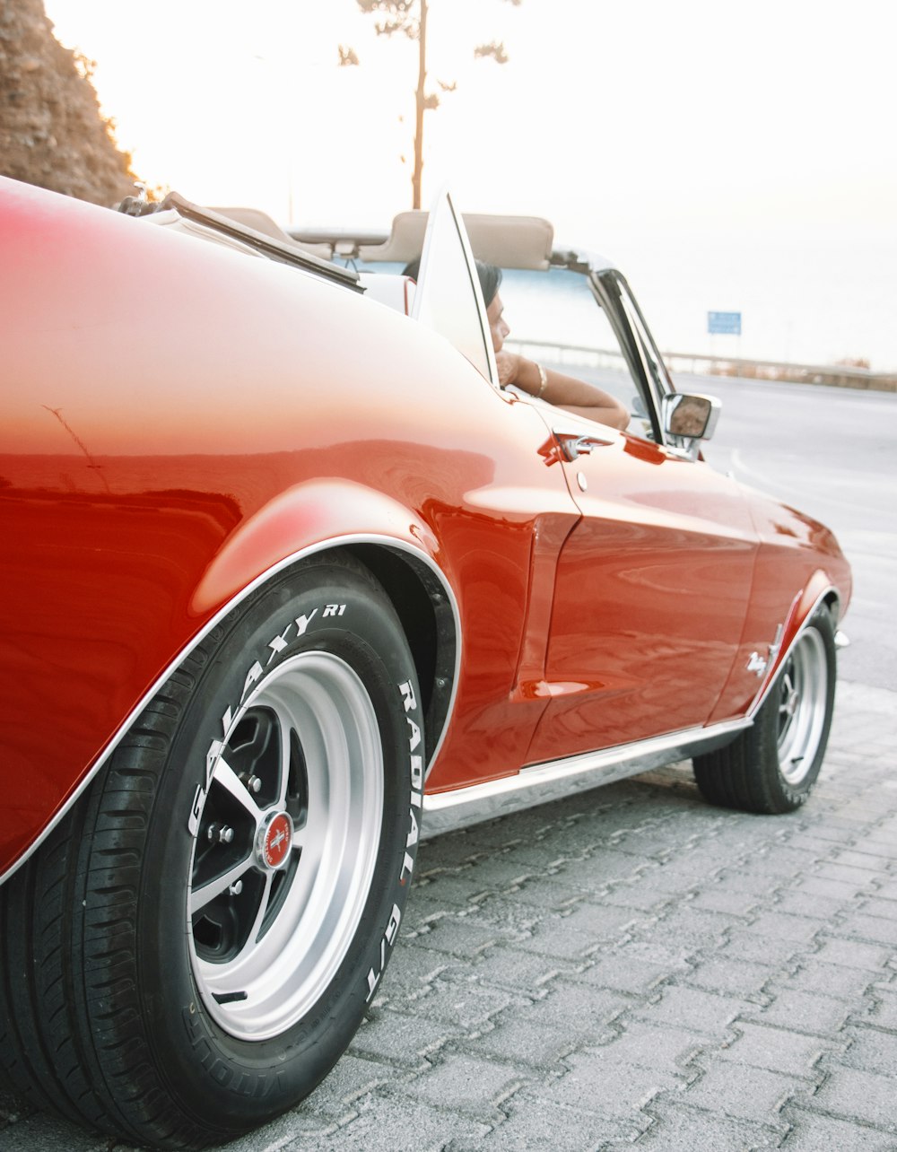 a red car parked on the side of the road