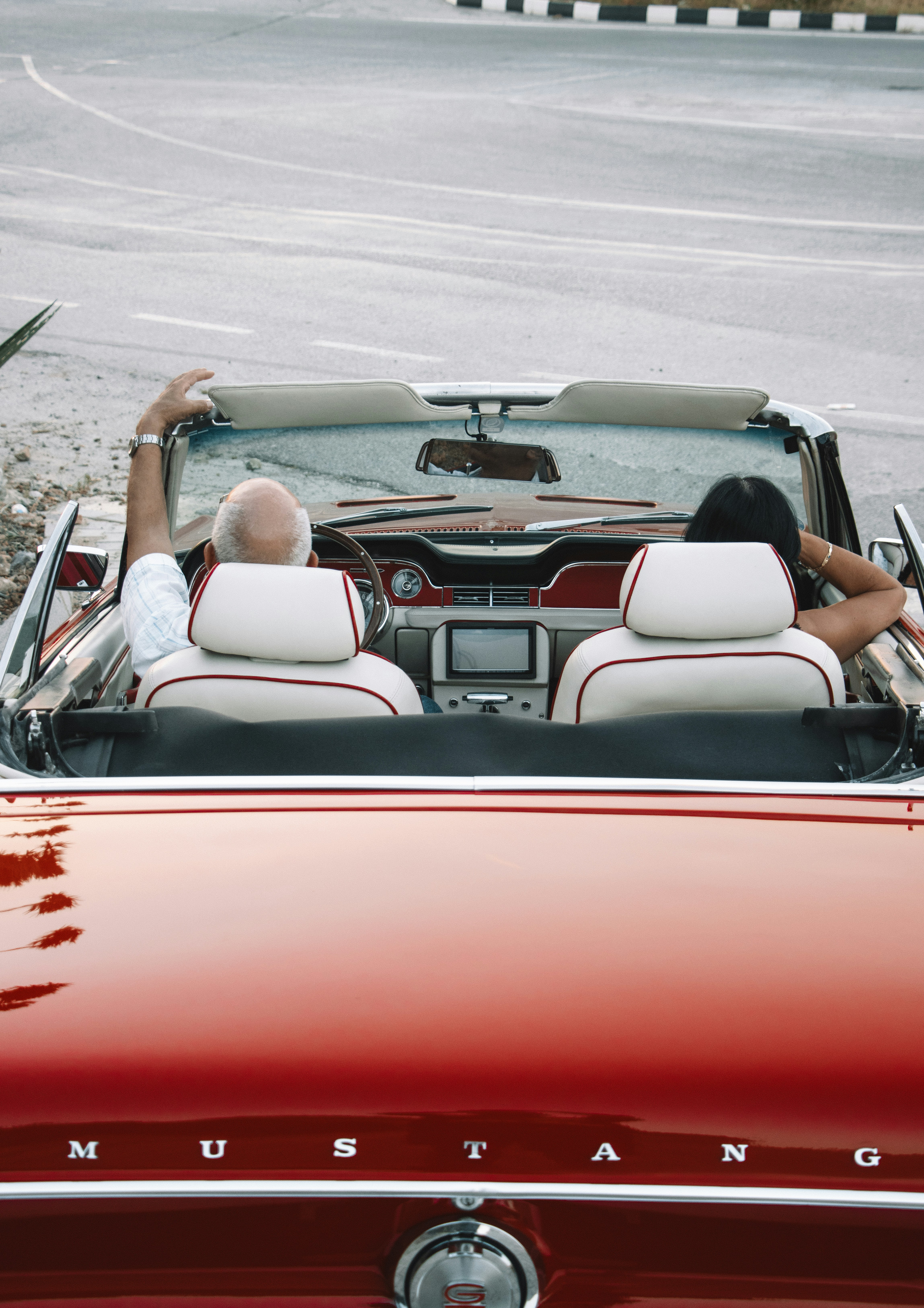a couple of people that are sitting in a car