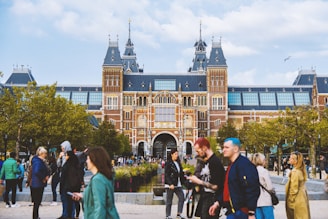 a group of people standing in front of a building