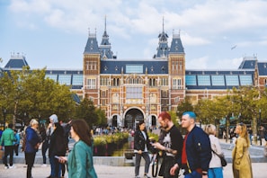 a group of people standing in front of a building
