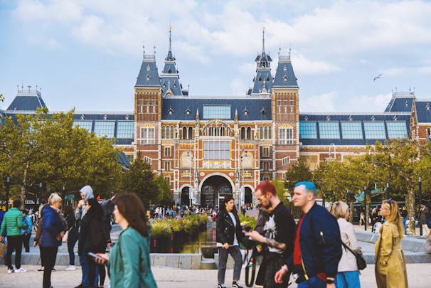 a group of people standing in front of a building