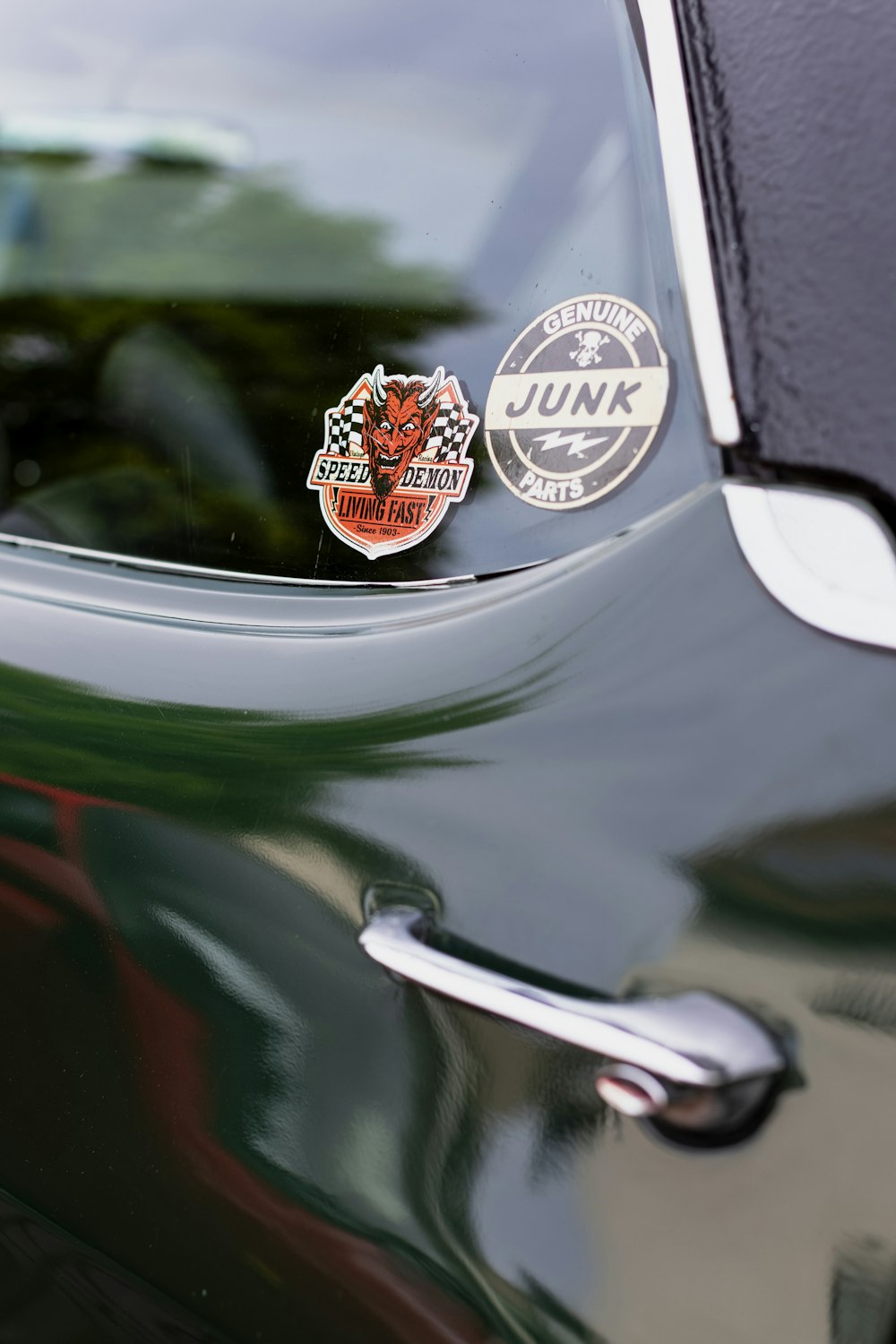 a close up of a car with stickers on it