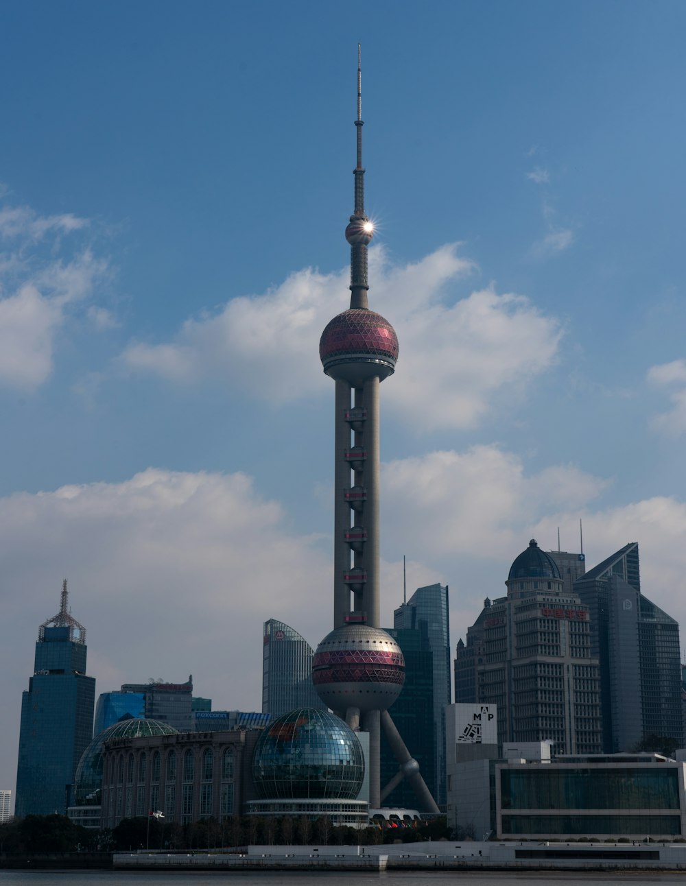 a very tall building with a very tall tower in the background