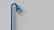 A minimalist scene featuring a blue water pipe against a plain, textured gray wall. The pipe has a slightly curved shape with a spout extending outward.