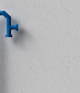 a blue handle on a white wall