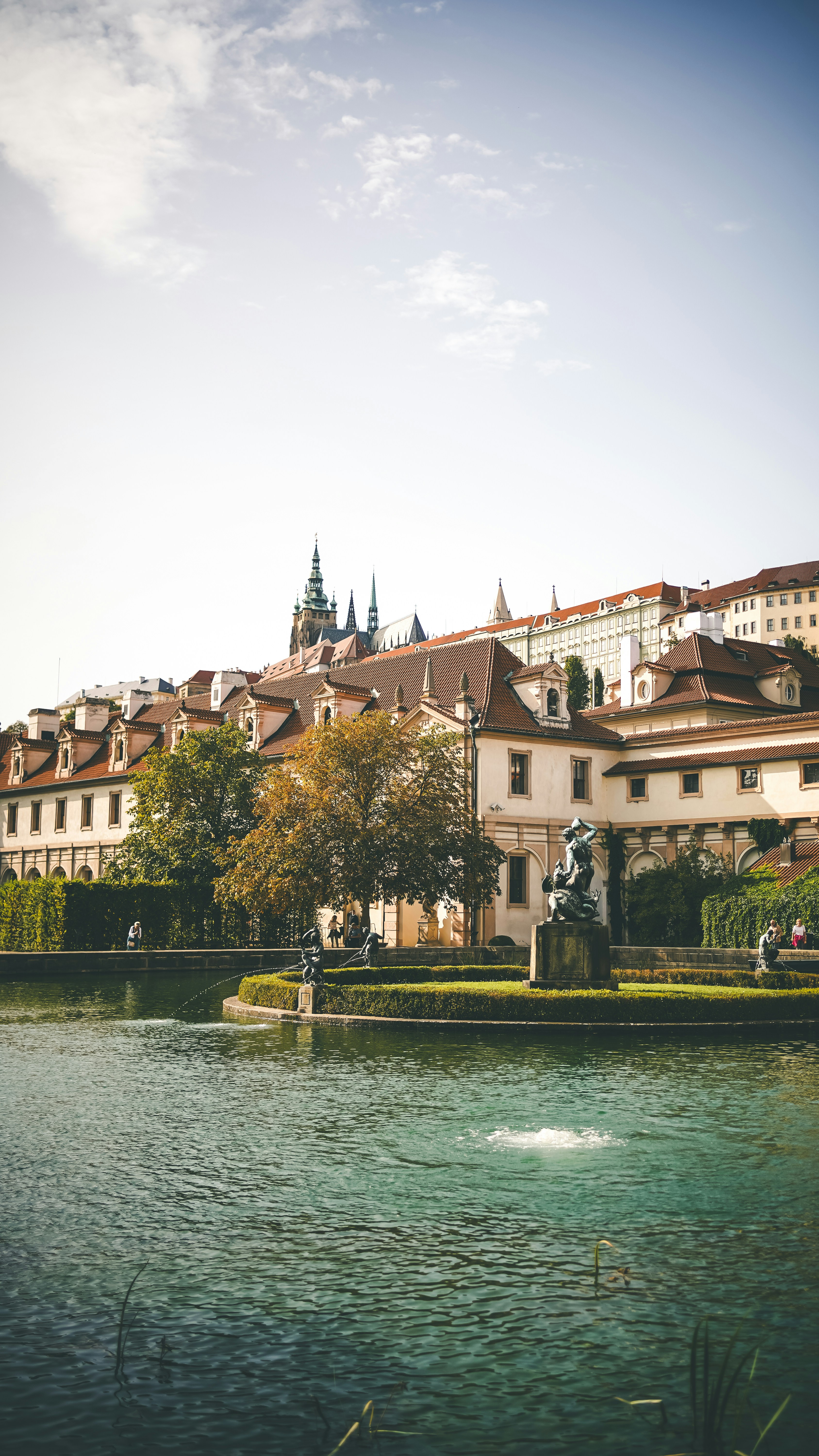 a large building with a fountain in front of it