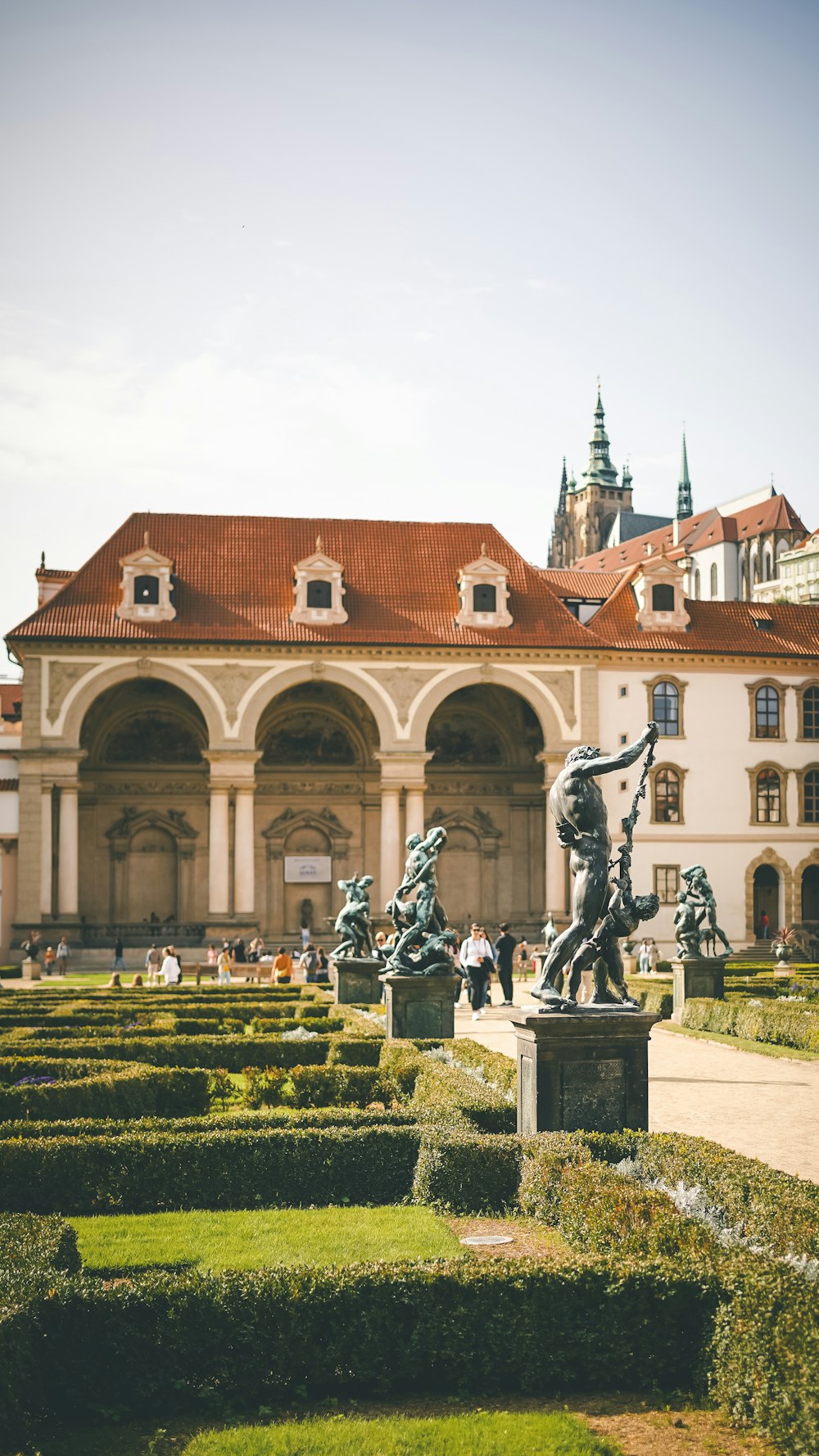 a large building with a garden in front of it