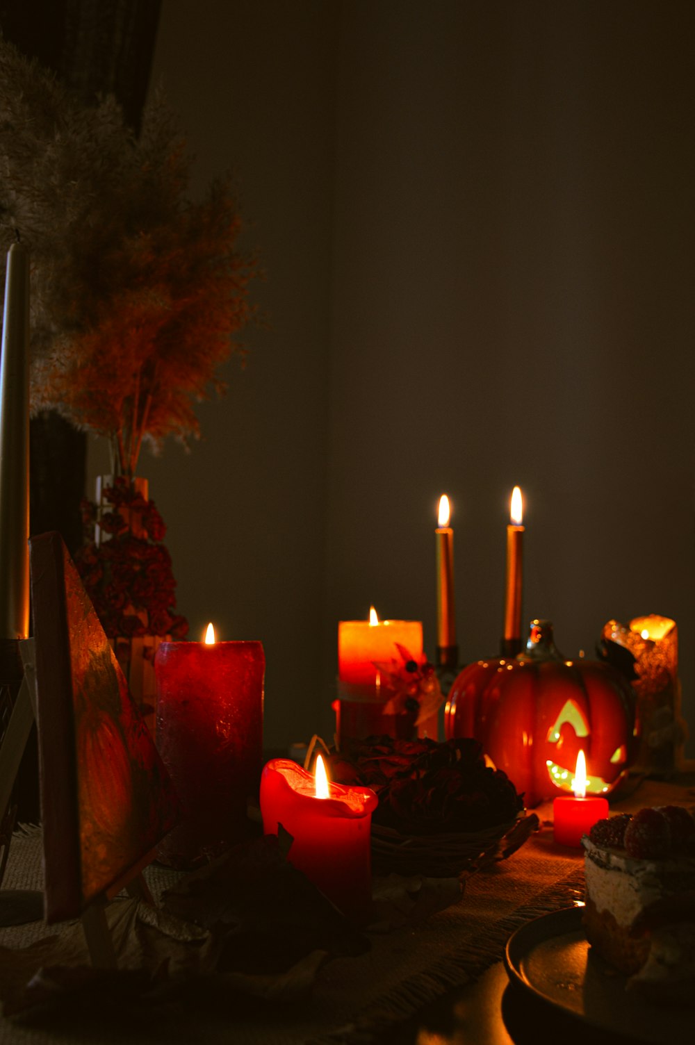 a table topped with lots of lit candles