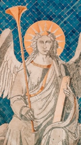 A detailed illustration of an angelic figure with wings, holding a long trumpet in one hand and a book in the other. The figure has a serene expression and is depicted with a halo radiating light. The background consists of blue mosaic tiles, adding depth and texture to the scene.