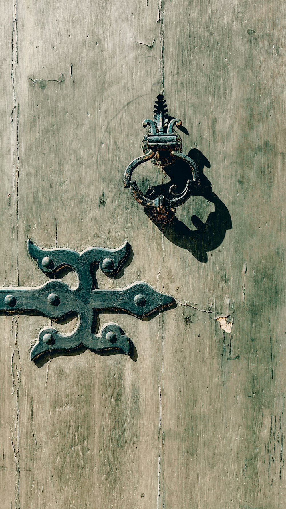 a door handle and a door handle on a wooden door