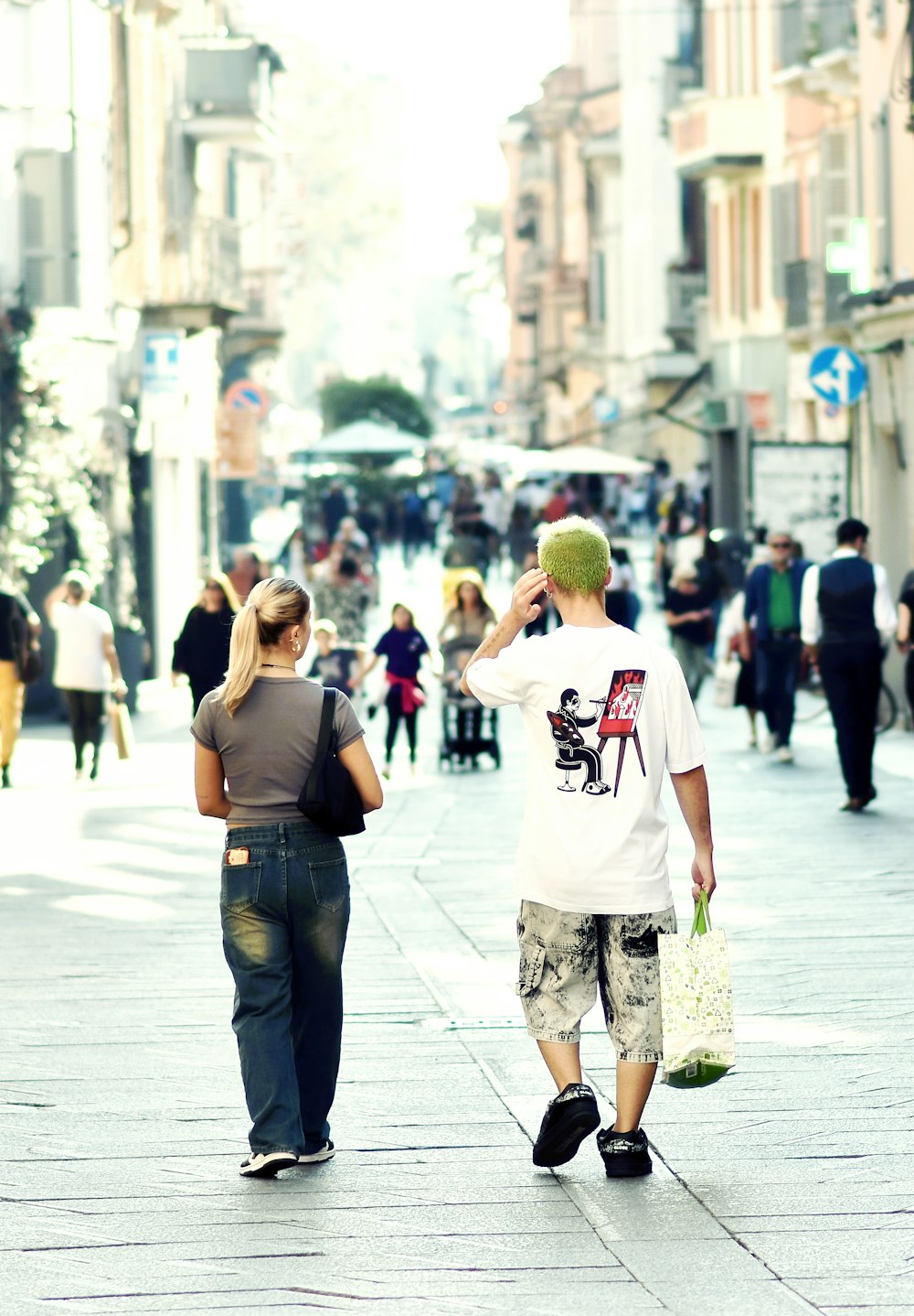 a man and a woman walking down a street