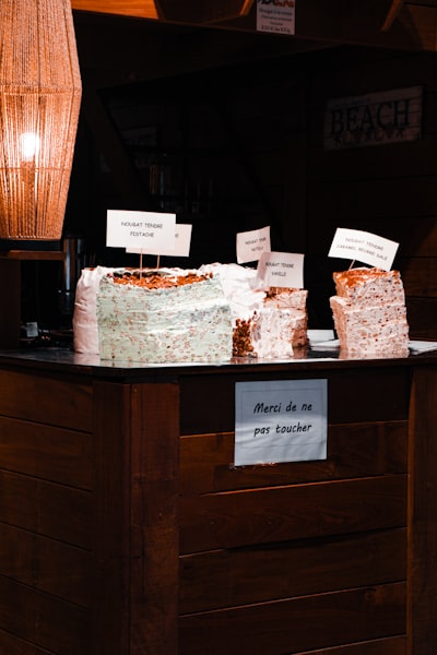 a table topped with a cake covered in frosting