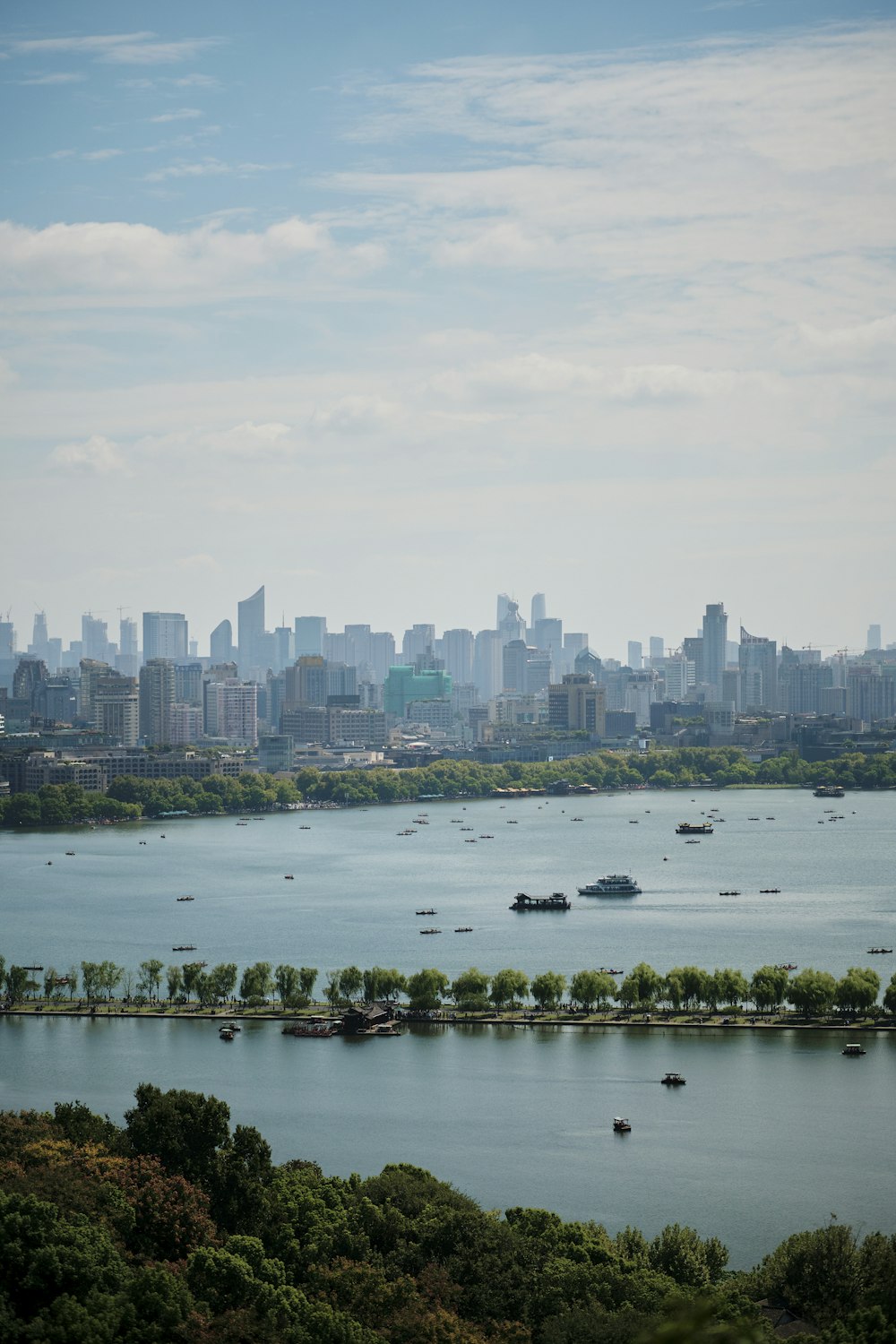 a large body of water with a city in the background