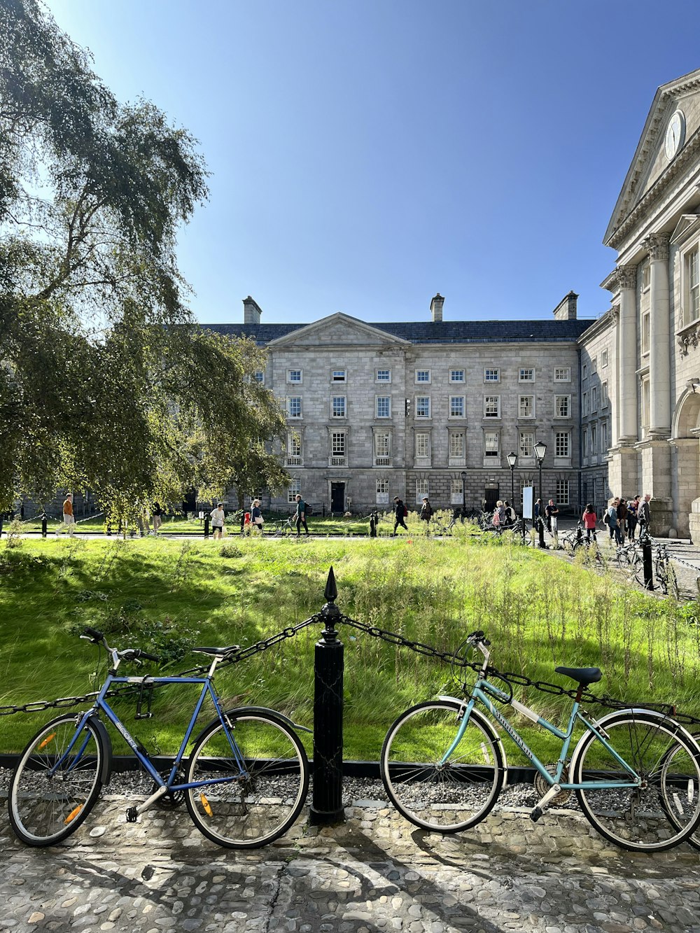 two bikes parked next to each other in front of a building