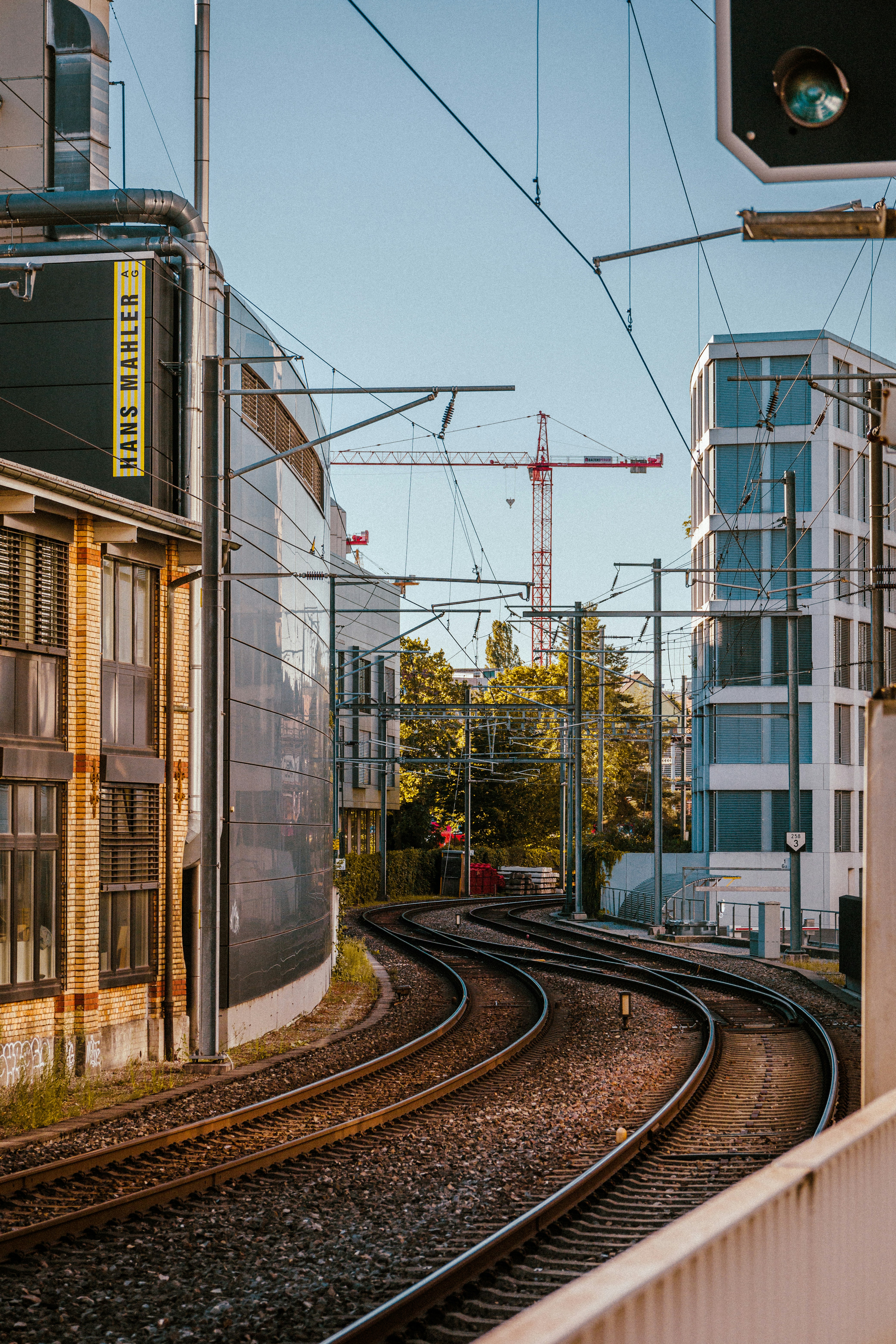 a view of a train track with a building in the background