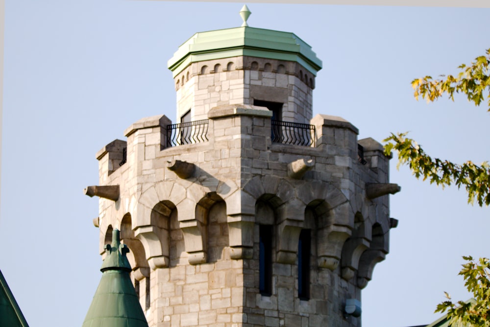 a tall tower with a clock on the top of it