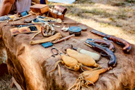 Historian consultant engaging guests with stories beside a beautifully decorated era-specific table.
