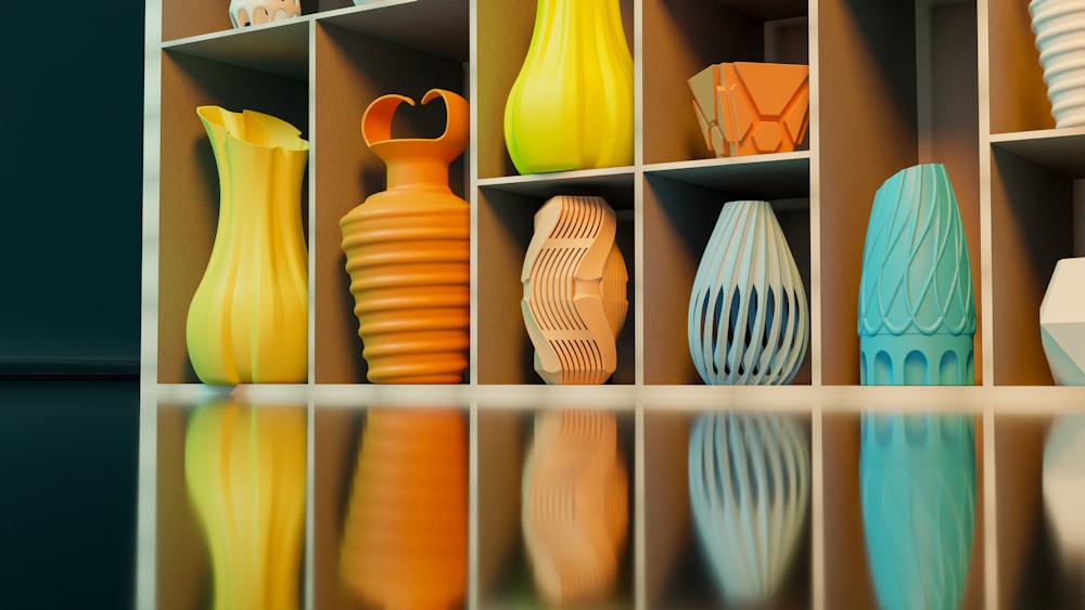 a shelf filled with lots of different colored vases