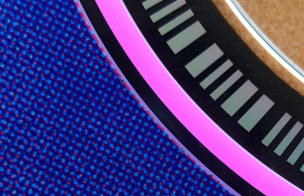 a close up of a blue and black speaker