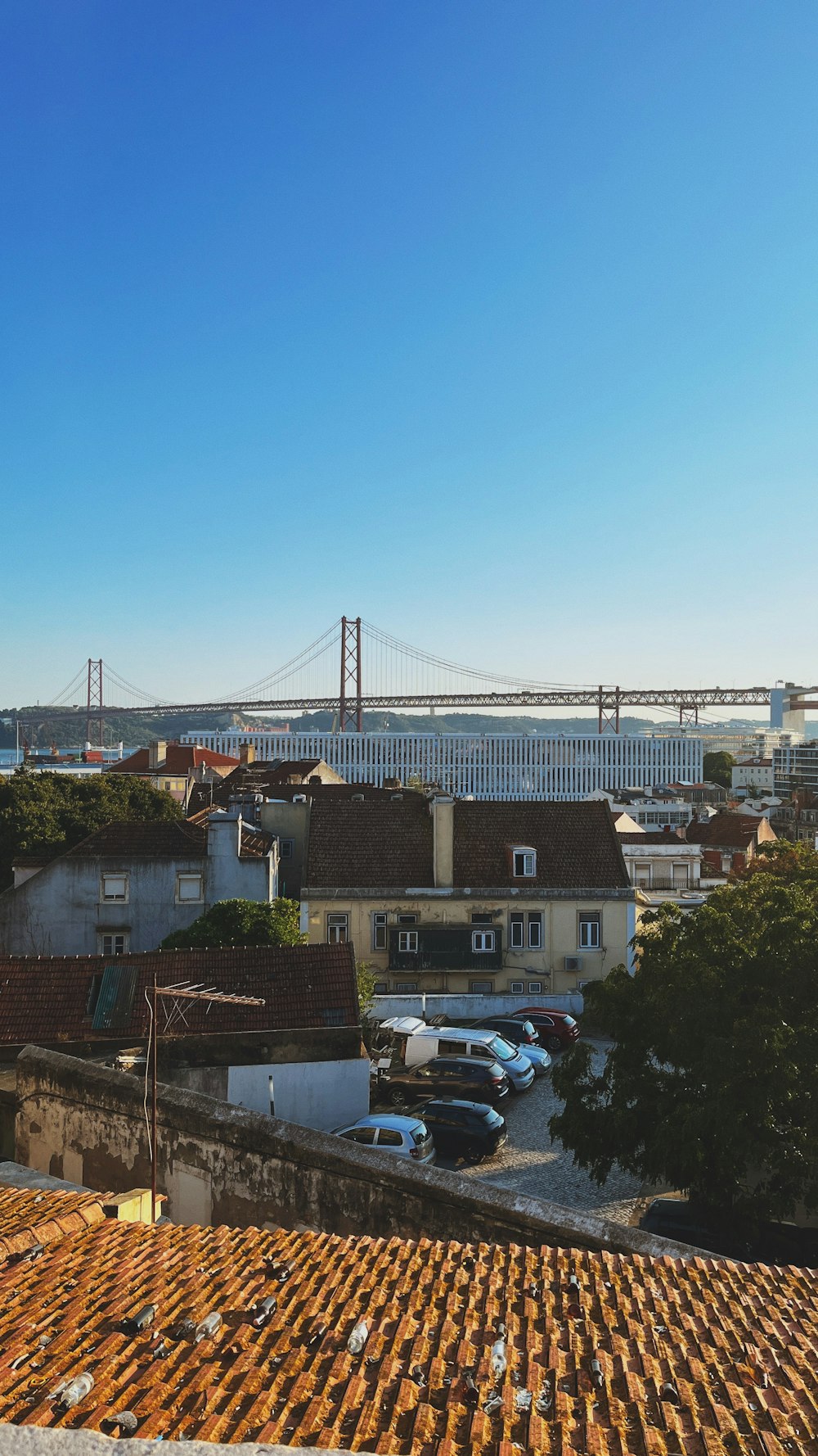 a view of a bridge from a rooftop of a building