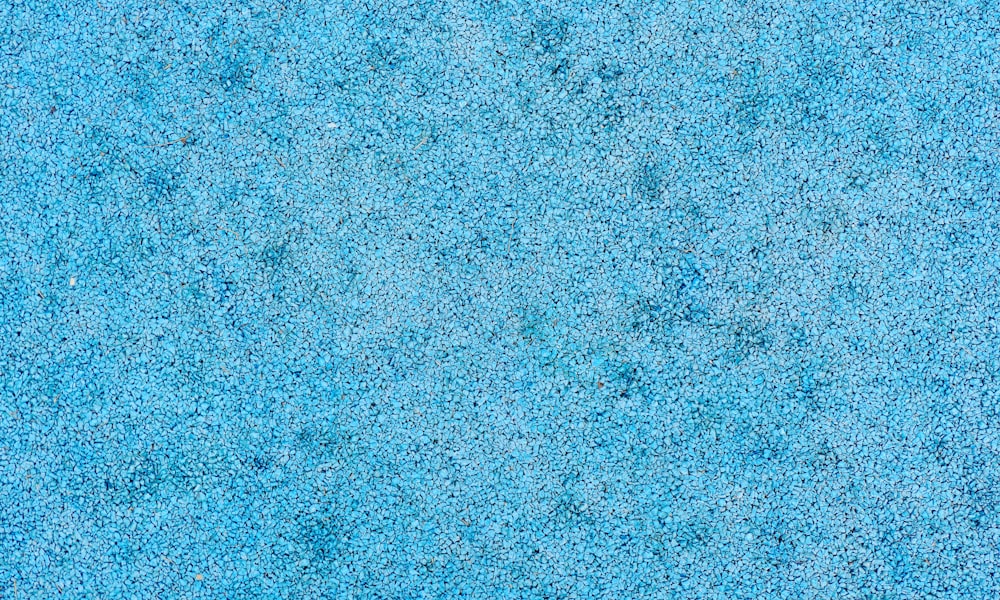 a close up of a blue carpet texture