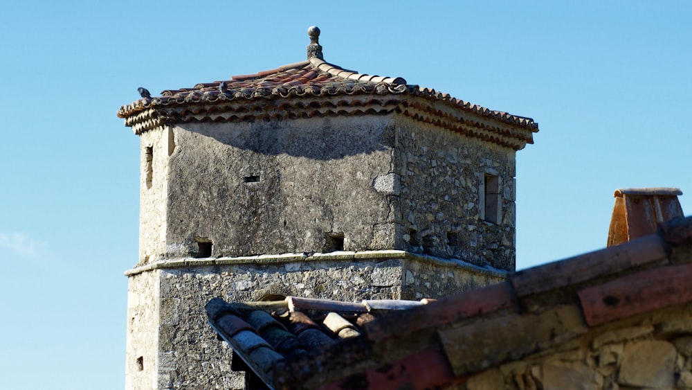 a tower with a bird on top of it