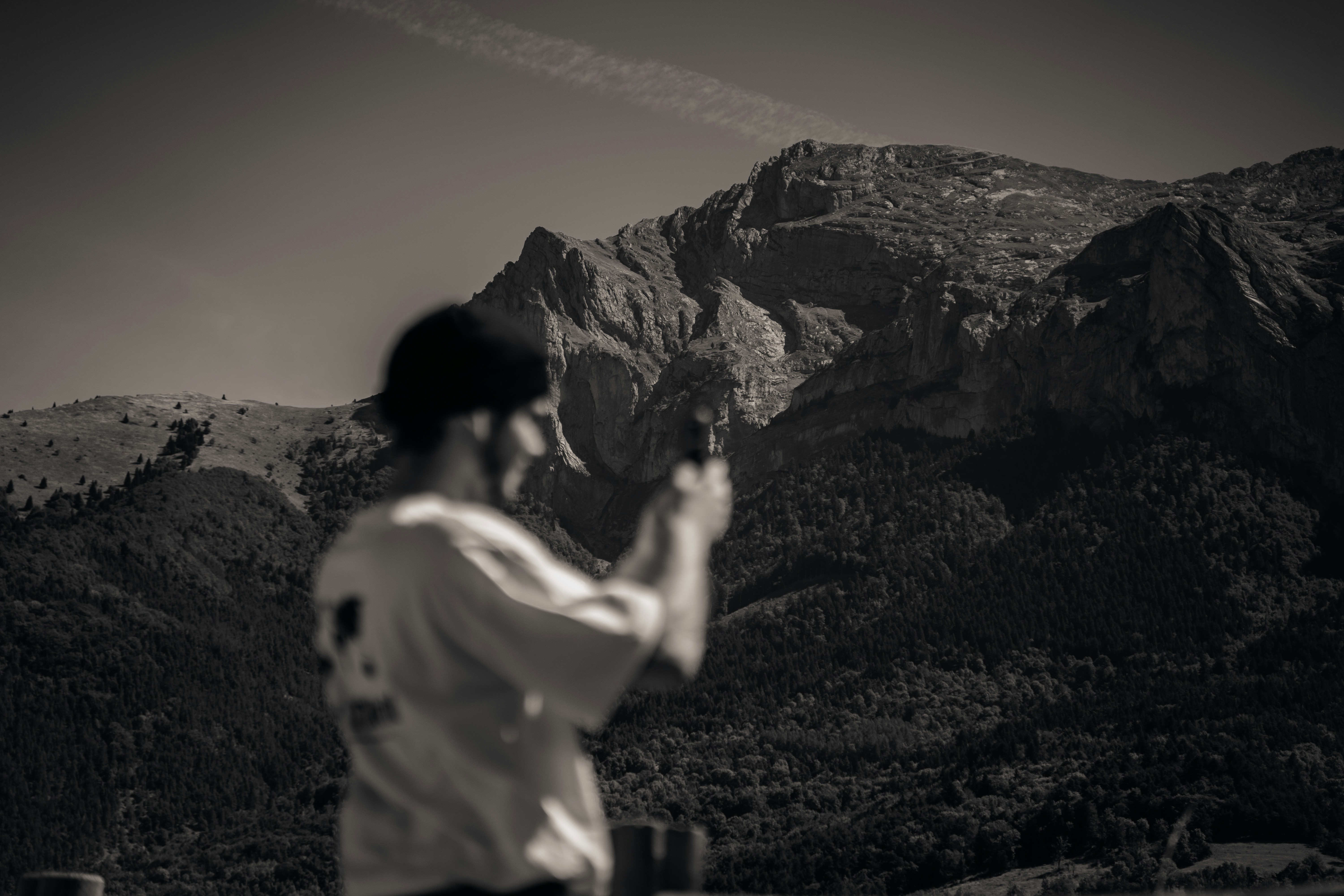 a man standing in front of a mountain