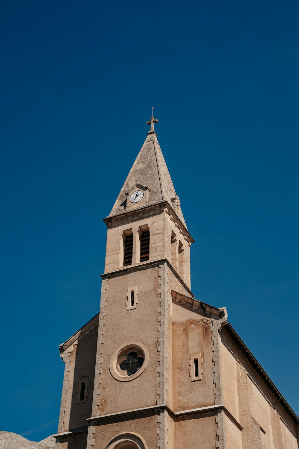 a tall building with a clock on the top of it