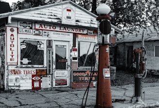 A vintage gas station with rustic signage and warm lighting.