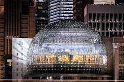 a large glass dome in the middle of a city