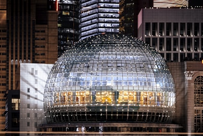 a large glass dome in the middle of a city