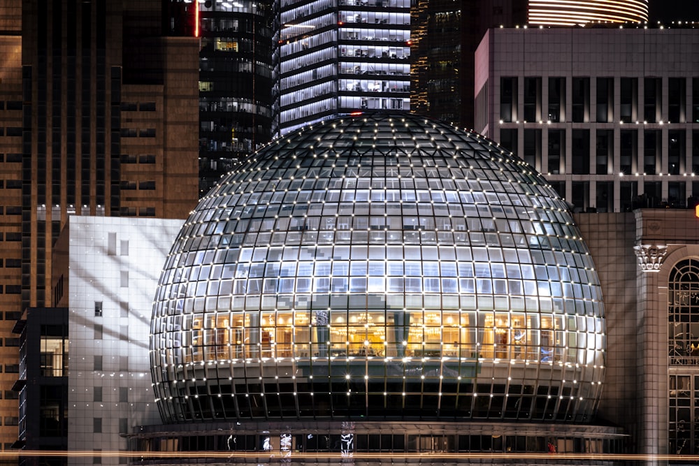 a large glass dome in the middle of a city