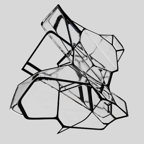 A complex geometric structure composed of interconnected transparent panels and black outlines. The structure is abstract, creating an intricate pattern of reflections and angles.